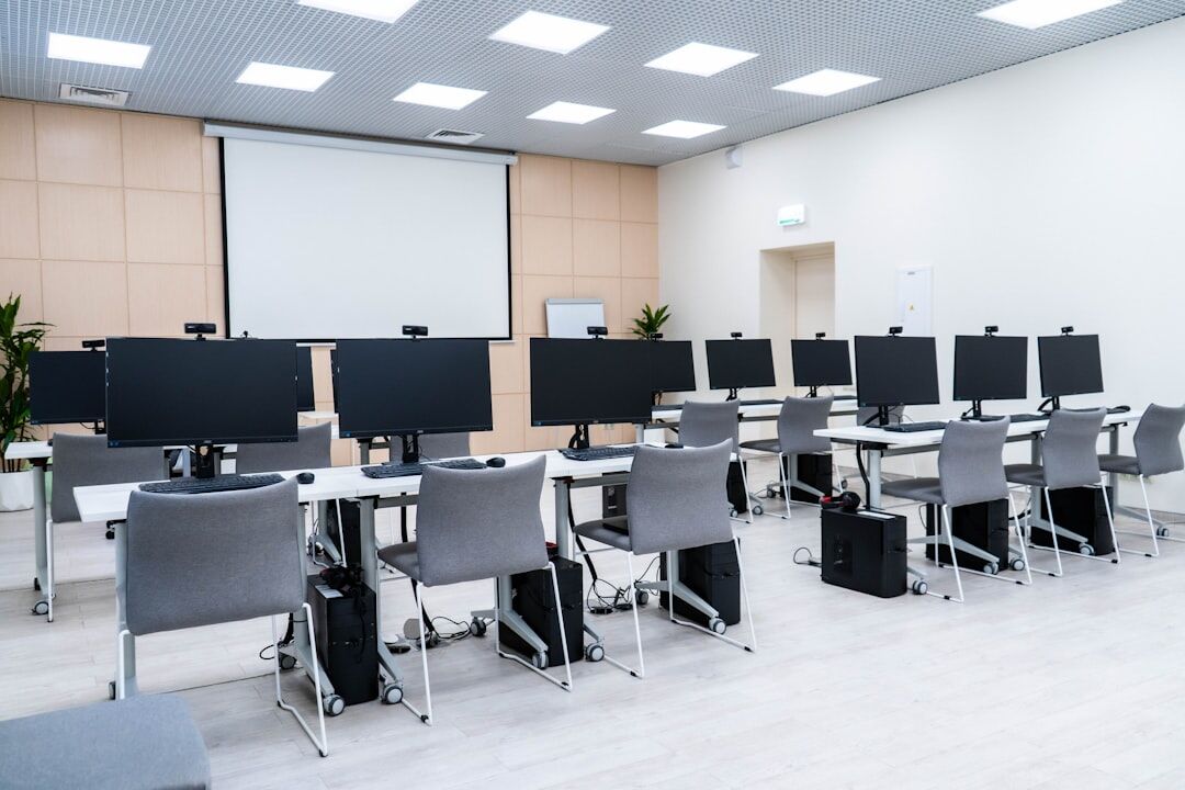 Modern media production classroom with students and professional equipment