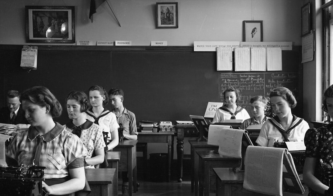 Students learning video production in a classroom with equipment